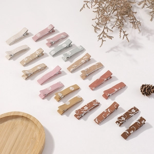 Detail of 20pcs embroidered floral linen hair clips in Morandi colors for kids