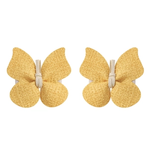 Texture détaillée de barrettes papillon jaunes faites main avec bandes élastiques