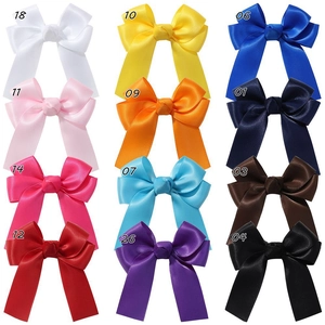Detailed grid showing 12 vibrant candy colors of satin bow hair clips with long streamers