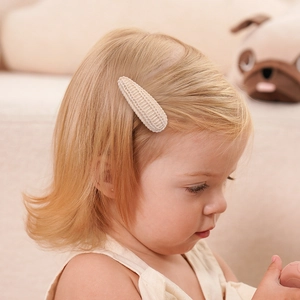 Girl's cream knit teardrop BB hair clip with handmade woven texture for autumn
