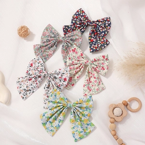 5-piece floral bow hair clips set for girls in minimalist preppy style fabric patterns