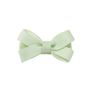 Detailed macro view of mint green grosgrain ribbon bow hair clip for children and girls