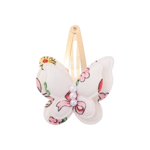Detail of double-layer butterfly hair clip with floral print and white pearls for girls