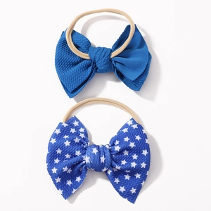 2-pack baby headbands with stars and solid navy waffle fabric bows on nylon elastic bands