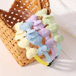 Lot de serre-têtes papillon double couche couleurs macaron pour filles dans un panier