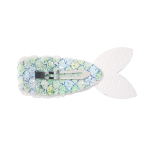 Close-up of the silver alligator clip on the back of a colorful mermaid tail sequin hair clip
