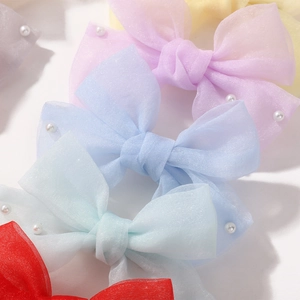 Pinces à cheveux nœuds en tulle avec perles blanches en diverses couleurs pastel