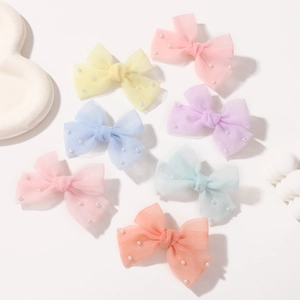 Ensemble de 7 barrettes nœuds en tulle avec perles aux douces couleurs macaron