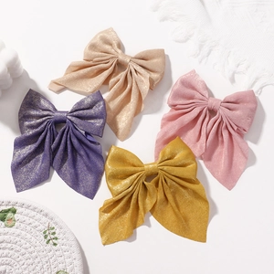 Set di 4 fermagli per capelli a fiocco in raso glitter viola, oro, rosa e giallo con nastri