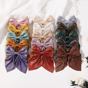 Set di 15 fermagli per capelli con fiocchi in raso glitterato in vari colori per ragazze