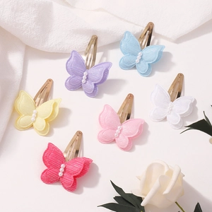 Détail de barrettes papillon double couche à paillettes et perles pour enfants et bébés