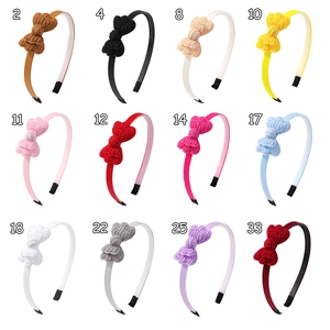 Detailed grid view of 12 colors of knitted bow headbands for girls with SKU numbers
