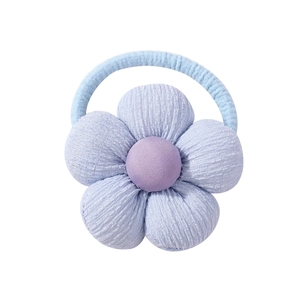 Detailed view of light blue linen sunflower hair tie with soft purple center for girls