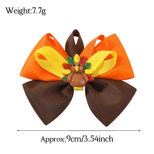 Handmade Thanksgiving turkey bow hair clip with orange and yellow grosgrain ribbon
