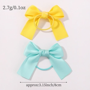 Detailed view of two polyester satin bow hair ties in bright yellow and mint green colors