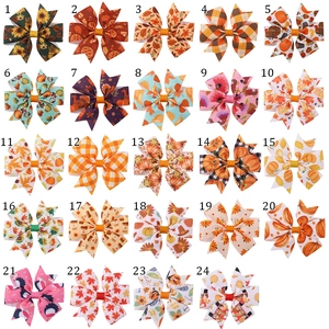 Detail view of 24-piece Thanksgiving hair bow set with pumpkin and turkey patterns