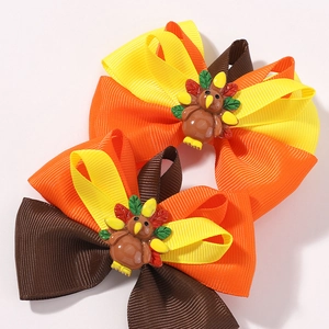 Handmade Thanksgiving turkey hair bow clips with layered ribbons for festive girls' accessories