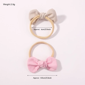Set of two elastic bow headbands for baby girls in pink and beige colors