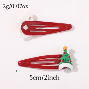 Détail de barrettes de Noël de 5cm avec décorations festives en résine et clip BB