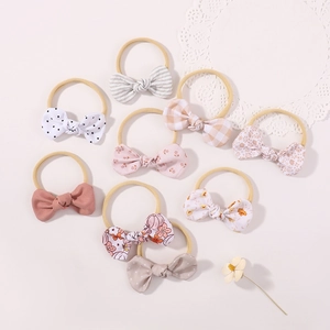 Set of 8 baby nylon headbands with floral and polka dot bows for newborns and infants