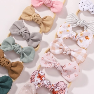 Infant bow headband set with solid colors and polka dot patterns for newborn girls