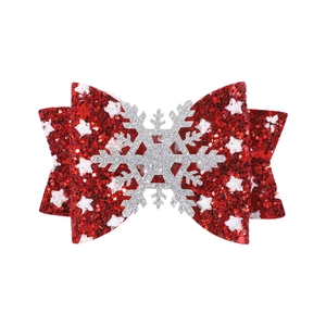 Vue détaillée du nœud de Noël en paillettes rouges avec motifs de flocons et décor argent