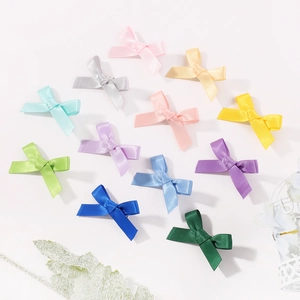 Set of 11 colorful 4.5cm satin ribbon bow hair clips for girls in various vibrant colors