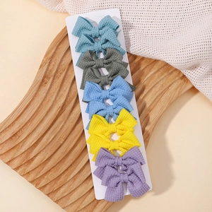 Set di 5 fermagli per capelli a fiocco a righe per bambine in tessuto waffle
