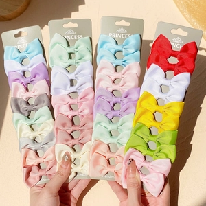 Colorful grosgrain ribbon bow hair clips set on display cards for girls