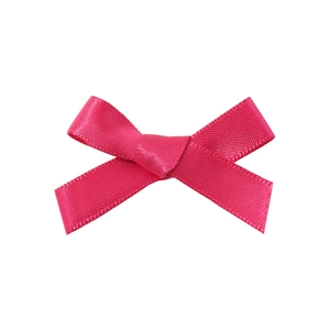 Close-up of a magenta satin ribbon bow hair clip with detailed twill weaving texture