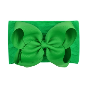 Emerald green wide nylon elastic headband for babies with a large ribbed double bow