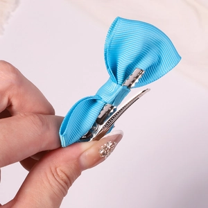 Vibrant blue grosgrain ribbon bow hair clip with silver metal alligator clip for girls