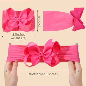 Detail of rose pink baby headband showing elastic ribbed fabric and stretch dimensions