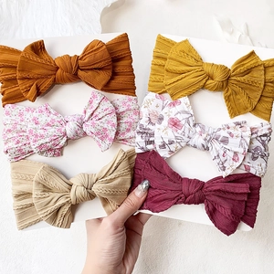 Set of six soft nylon baby headbands with large bows in floral and solid rib knit styles