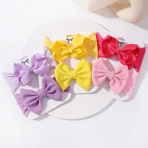 Detailed set of 6 nylon baby headbands with textured waffle bows in various vibrant colors