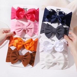 Multi-colored baby bow headband set with ribbed and waffle textures on display card