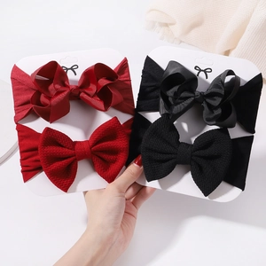 Set of baby bow headbands in red and black colors with waffle and ribbed textures
