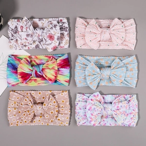 Detailed set of six ultra-soft nylon baby headbands with various floral and bow patterns