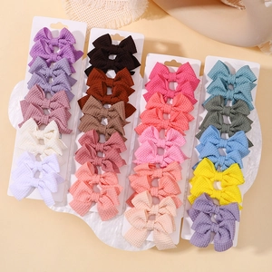 Set di fermagli per capelli a fiocco in tessuto a nido d'ape per bambine colorati