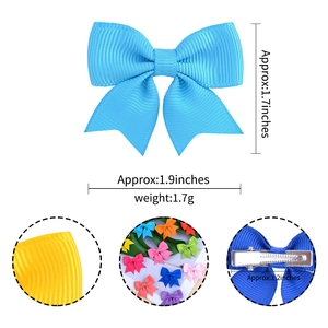 Detail of colorful grosgrain ribbon bows and silver metal alligator hair clips