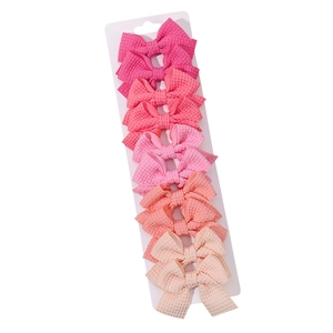 Set di 10 fermagli per capelli a fiocco in tessuto a nido d'ape rosa per bambine