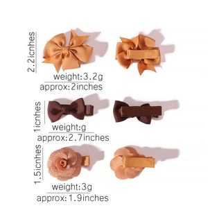 Detail showing fabric bow hair clips with specific dimensions and weight specifications