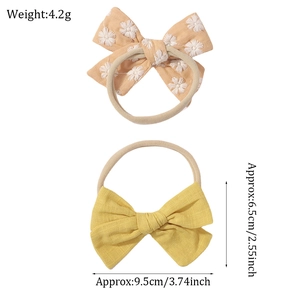 Elastic baby headband set with floral embroidery and yellow linen bows for infants