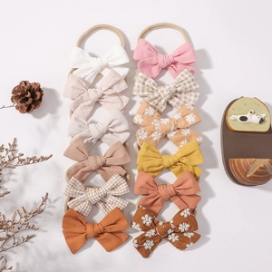 Set of 12 nylon baby headbands with colorful cotton linen bows and floral embroidery