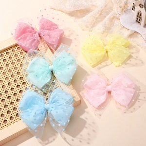 Five-piece set of girls mesh bow hair clips in pastel macaron colors with polka dot detail