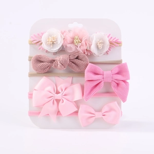 Détail lot de 5 bandeaux bébé avec nœuds en velours côtelé et fleurs en maille