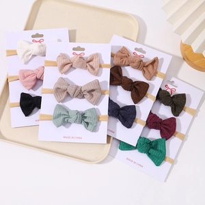 Three-piece set of baby ribbed fabric bow headbands on high-elastic nylon bands
