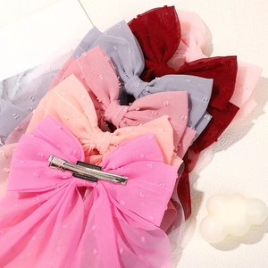 Set of large mesh bow hair clips in multiple colors with delicate polka dot texture