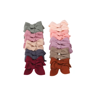 Set of 10 waffle knit bow hair clips for baby girls in various morandi colors