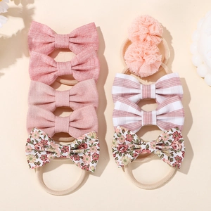 8-piece set of baby bow headbands in pink linen, floral print and mesh pom-poms